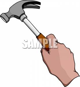 Hand holding hammer.
