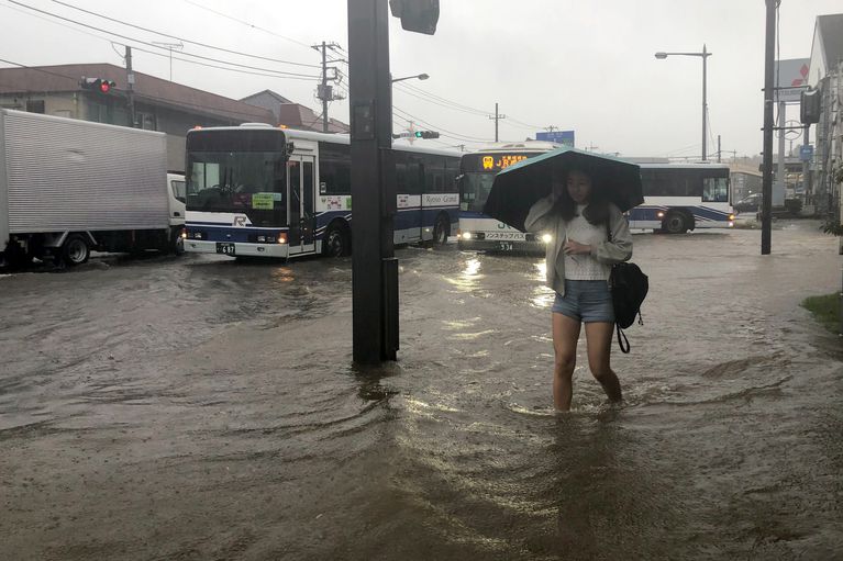 Heavy rains flood areas of Japan recovering from typhoons