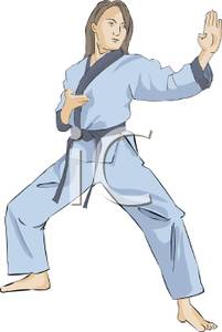 A Woman In a Karate Uniform In a Karate Stance